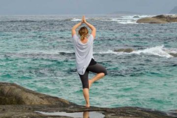 Yoga pose in front of ocean